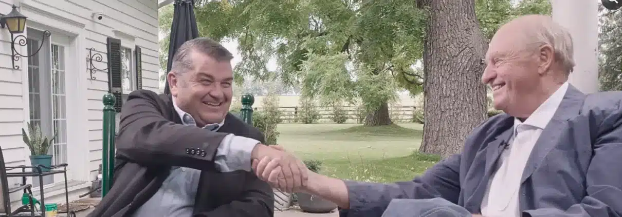 Scott Crone and Dr. Watson Share a Handshake