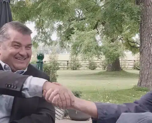 Scott Crone and Dr. Watson Share a Handshake